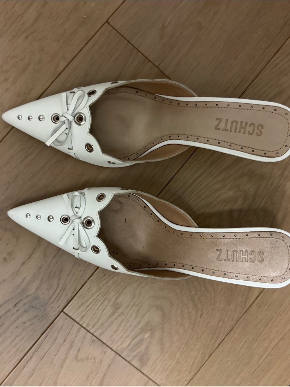 SCHUTZ White Pointed Toe Slip-On Mules with Eyelet Bow